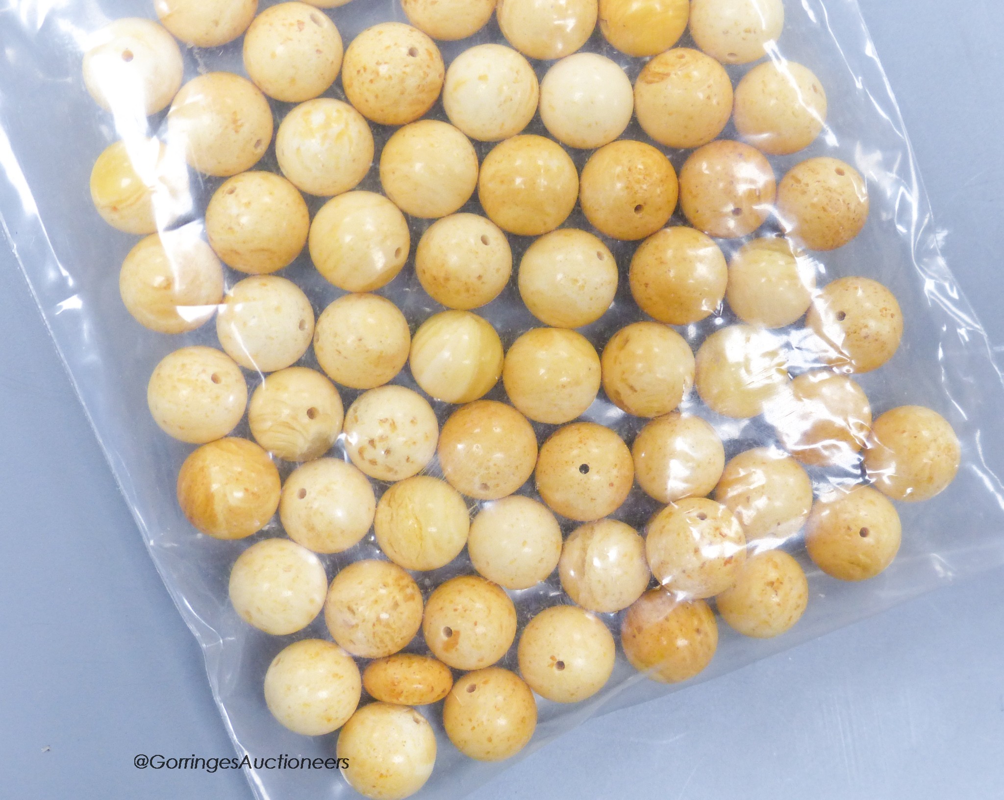 A quantity of loose amber prayer beads, gross weight 30 grams.